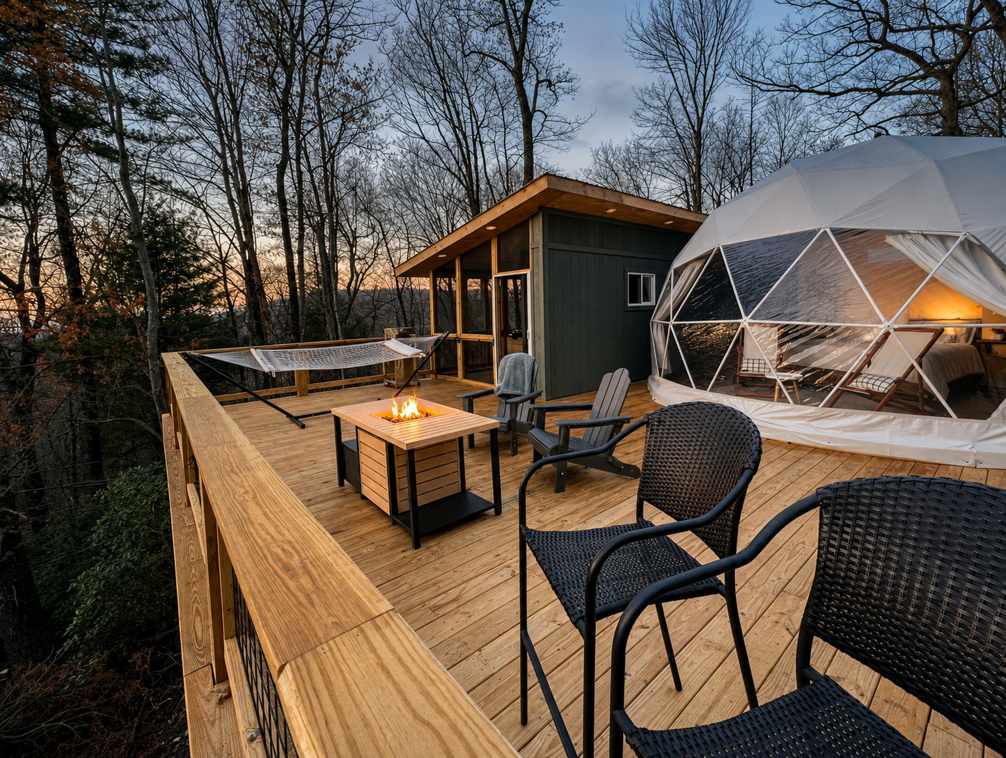 Forty-foot elevated deck with geodesic dome, fire table, and mountain views at dusk, custom built in the High Country by BluWolf Contracting