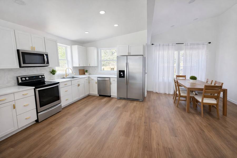 Renovated open kitchen with white shaker cabinets and brass hardware, High Country NC